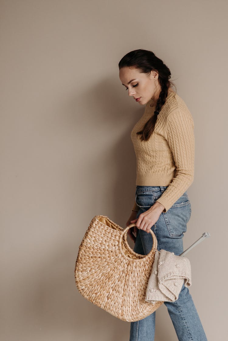 Woman Carrying A Woven Bag