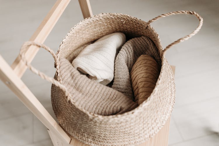 Folded Clothes Inside A Basket