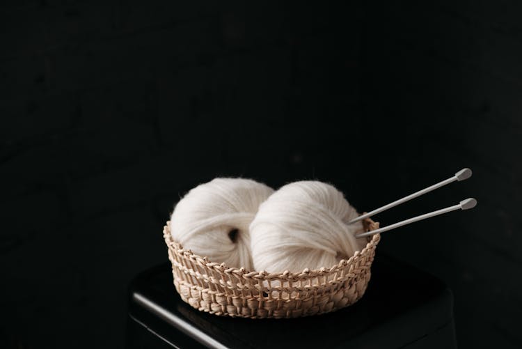 White Yarn On Brown Woven Basket