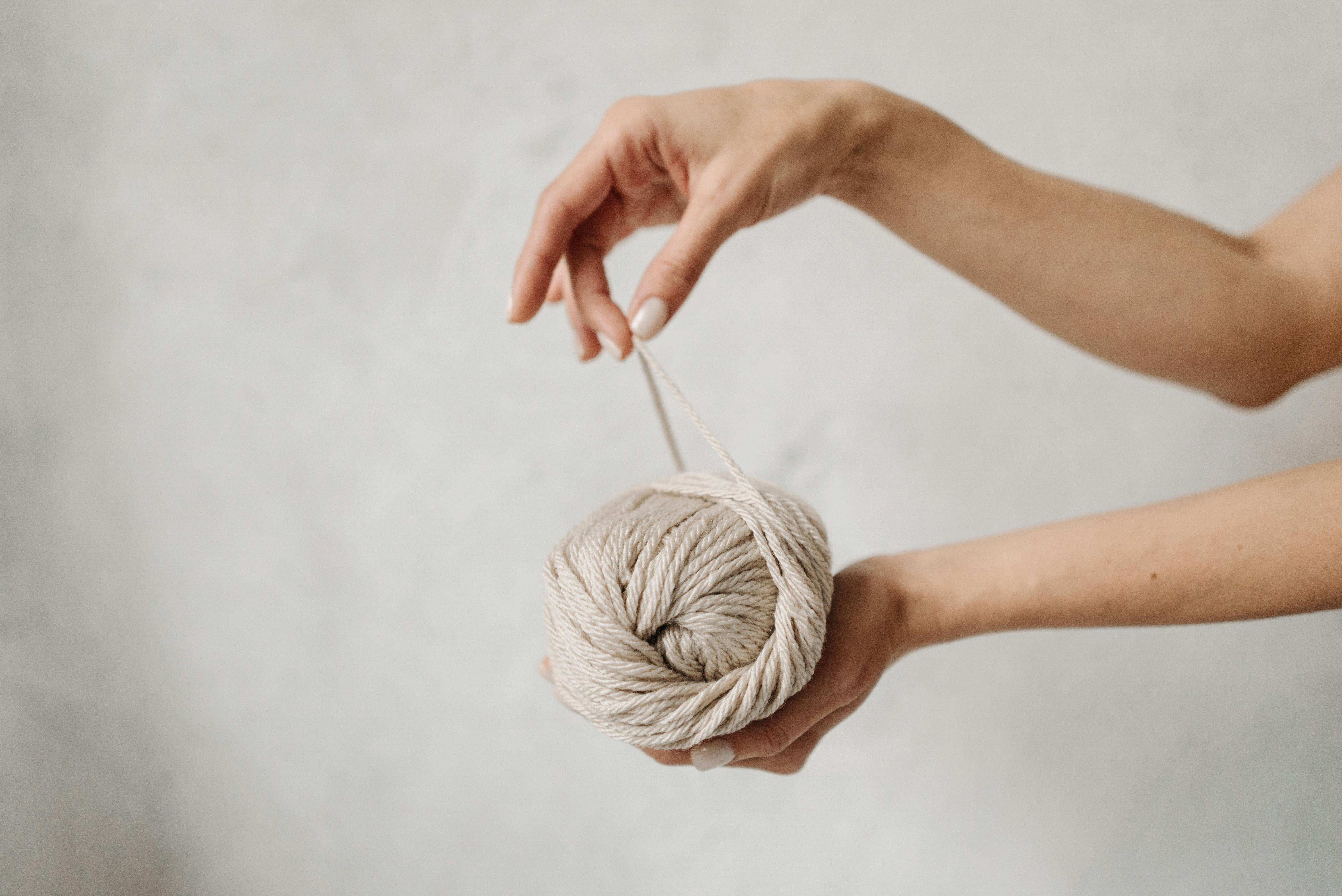 Girl Holding in Hand on of the Crochet Yarn Ball Stock Image