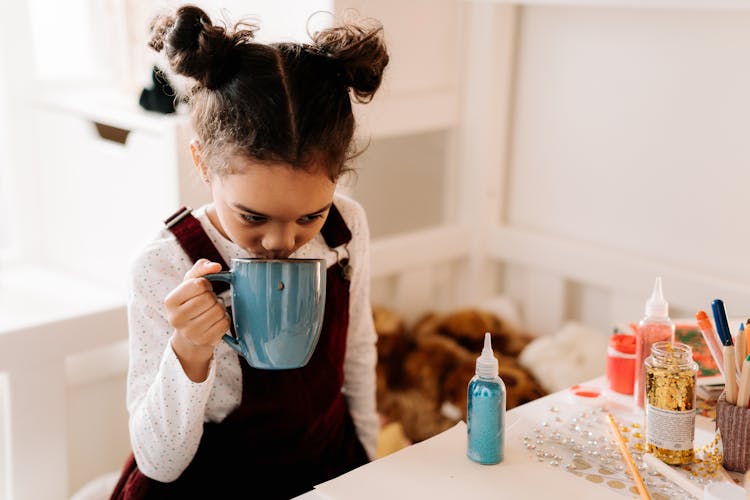 A Kid Drinking Hot Drink