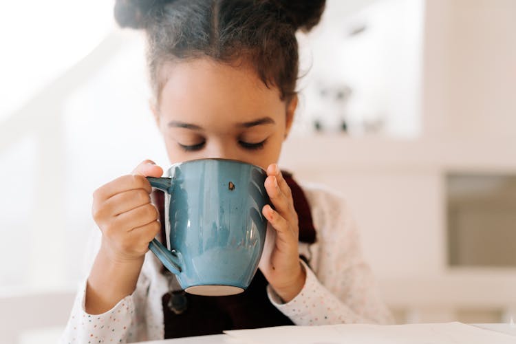 A Kid Drinking Hot Drink