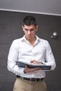 Man in White Dress Shirt Holding a Planner