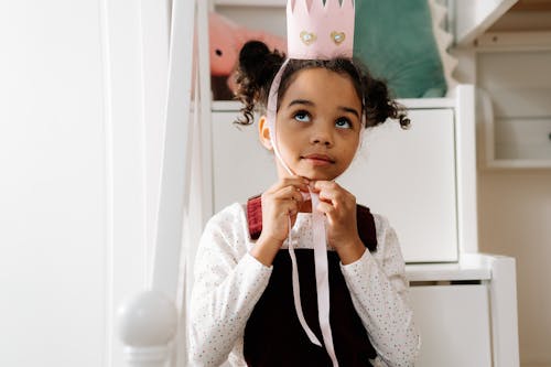 Free Girl Putting Her Crown Stock Photo
