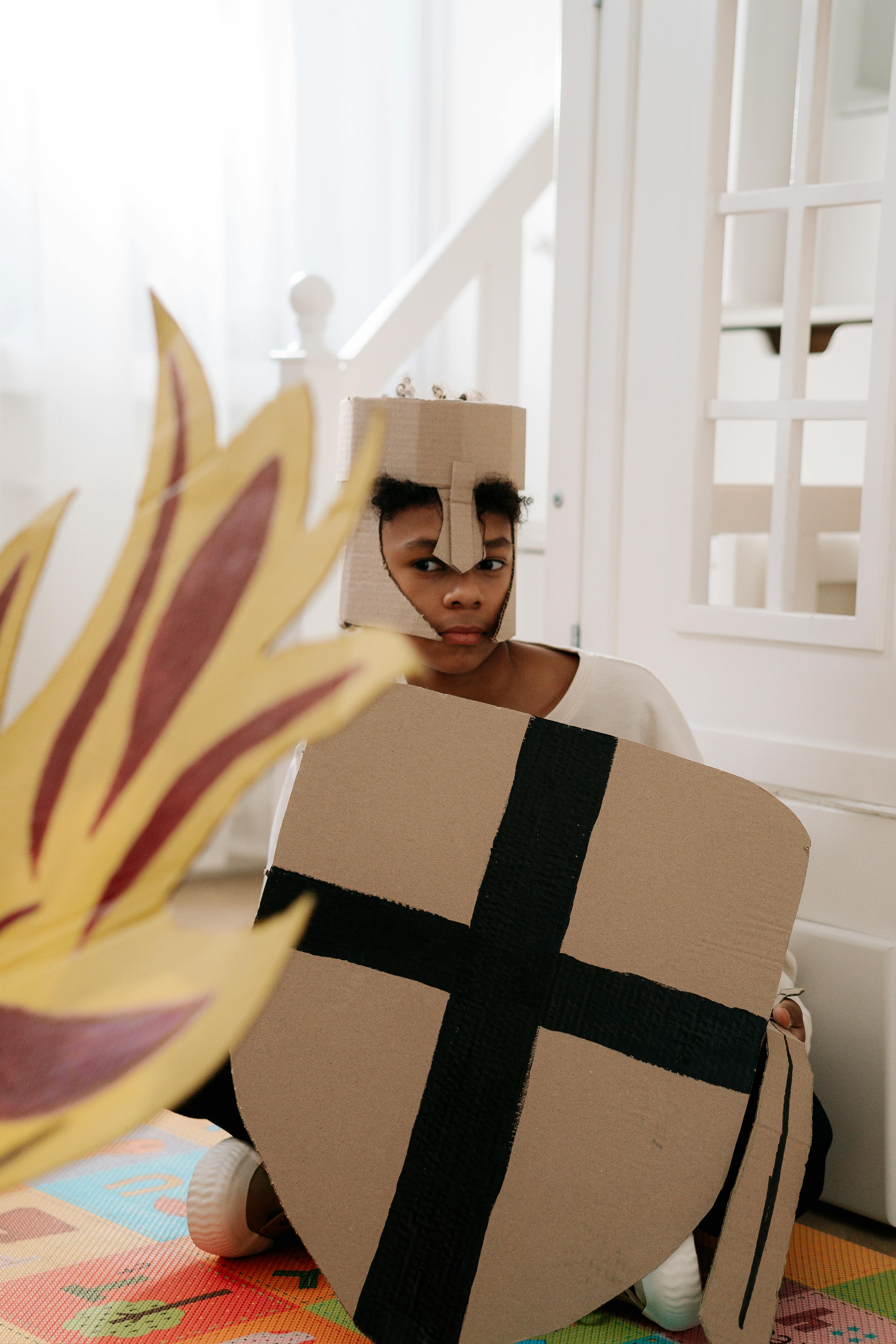 a boy wearing cardboard costume