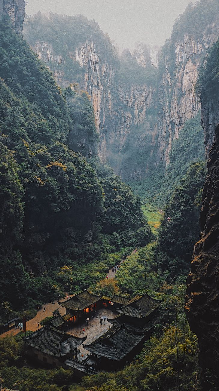 Breathtaking view of Wulong Karst's mountainous landscape and lush valley in China.