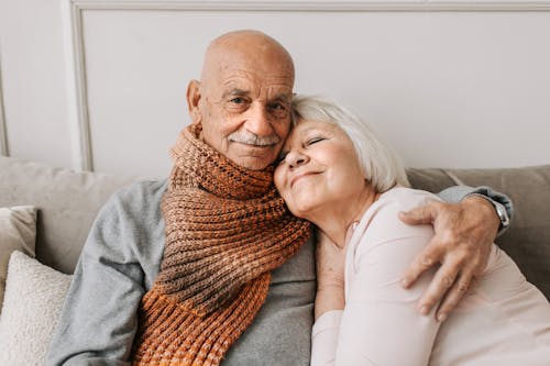 Free Man in Gray Sweater Hugging Woman  Stock Photo