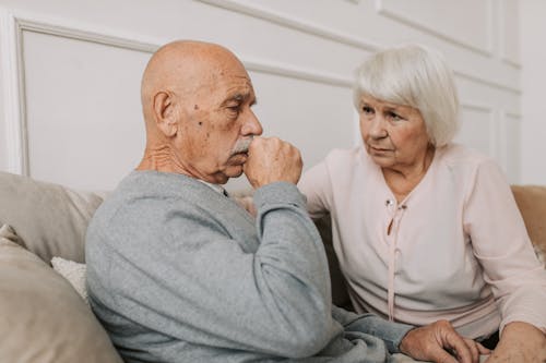 Free Woman Looking at Man in Gray Shirt Stock Photo