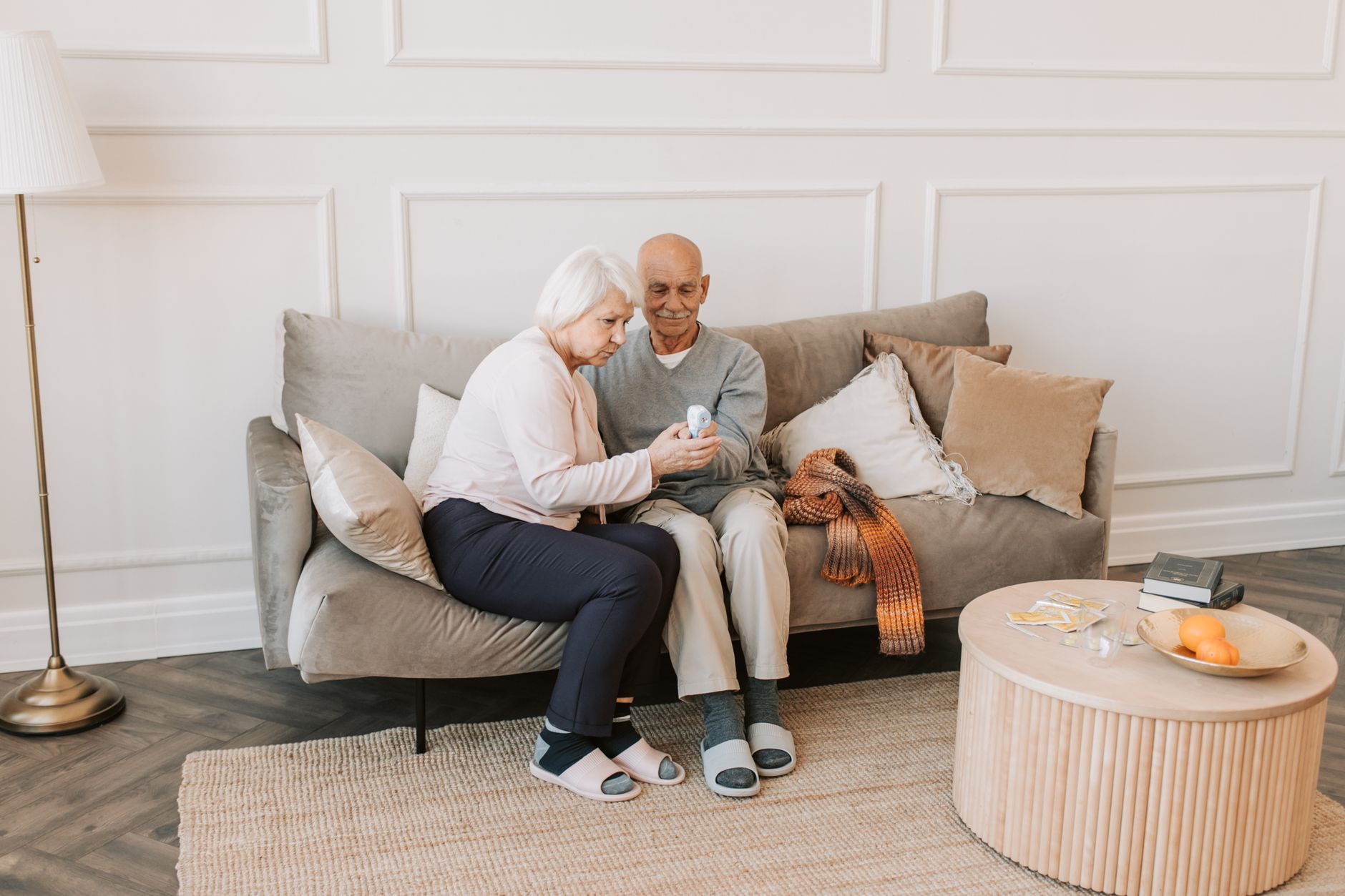 Man And Woman Sitting On White Couch Free Stock Photo man-and-woman-sitting-on-white-couch-free-stock-photo