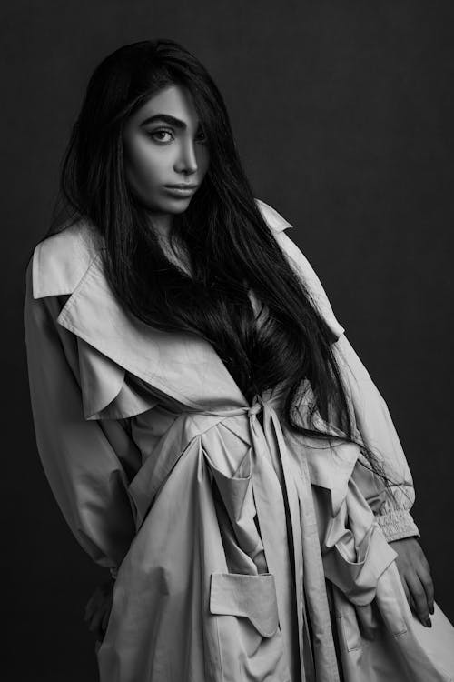 Grayscale Photography of Woman in Trench Coat