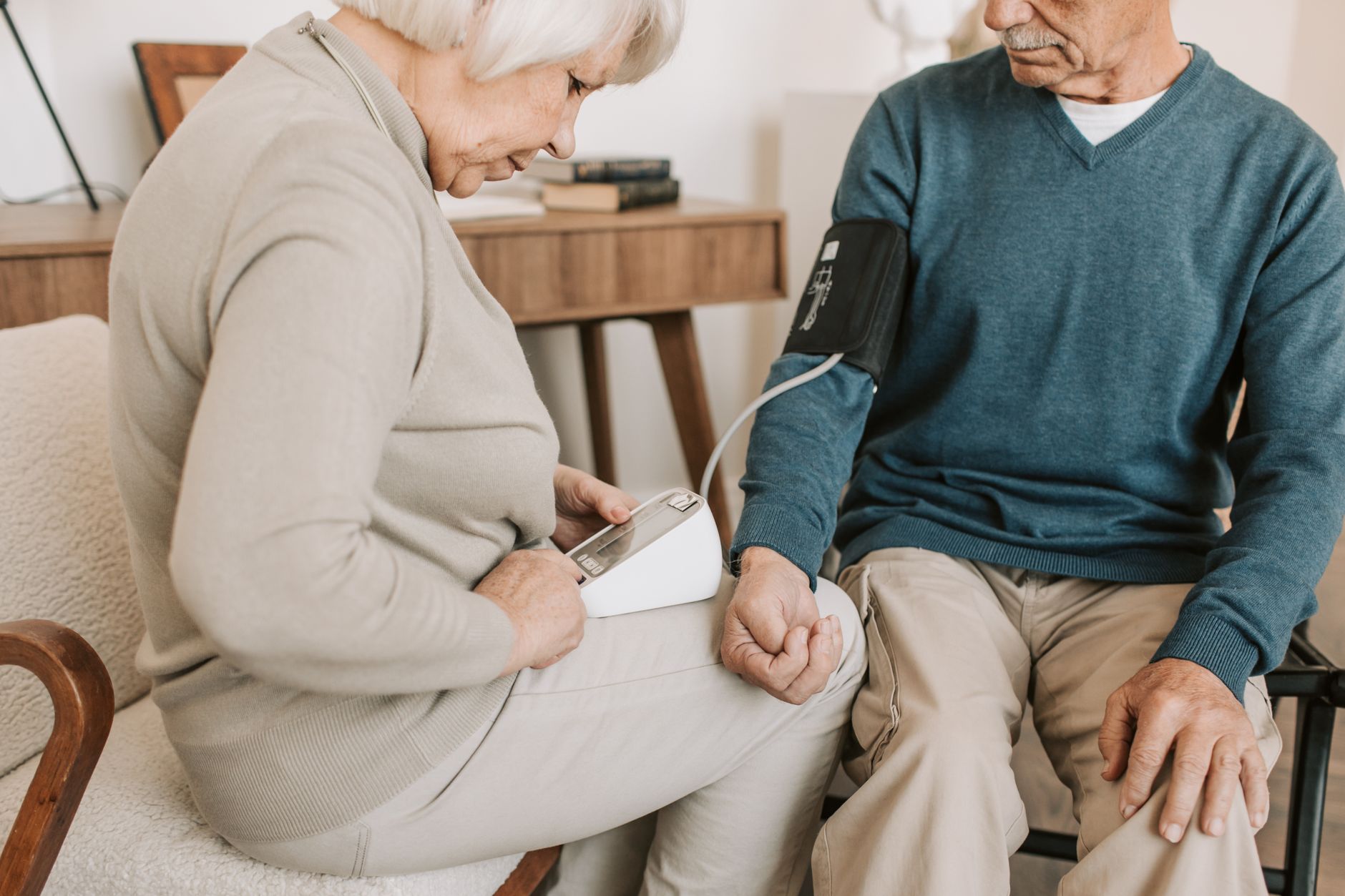 Older couple checking blood pressure at home, one of the cardiometabolic measures included in Life's Essential 8.