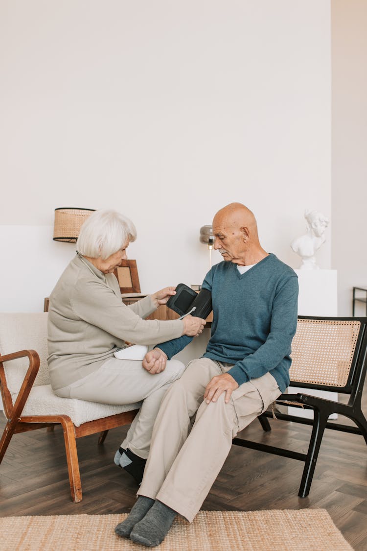 Woman Holding A Blood Pressure Cuff
