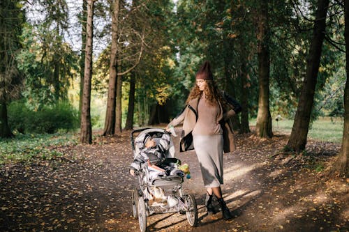 Woman with Her Baby in the Stroller