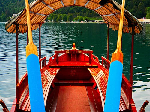 Red Boat on Body of Water