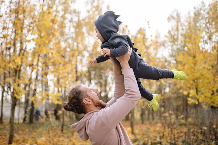 A Man Carrying His Son