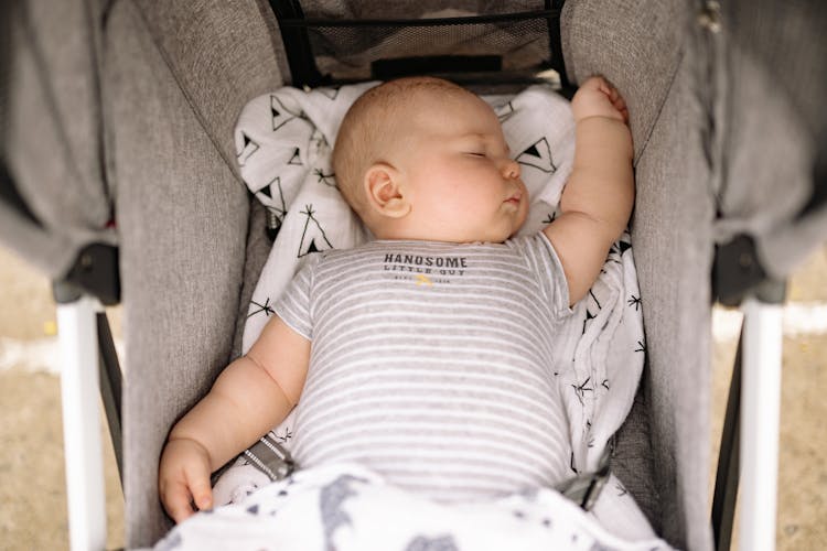 Baby In White And Gray Stripe Onesie Sleeping