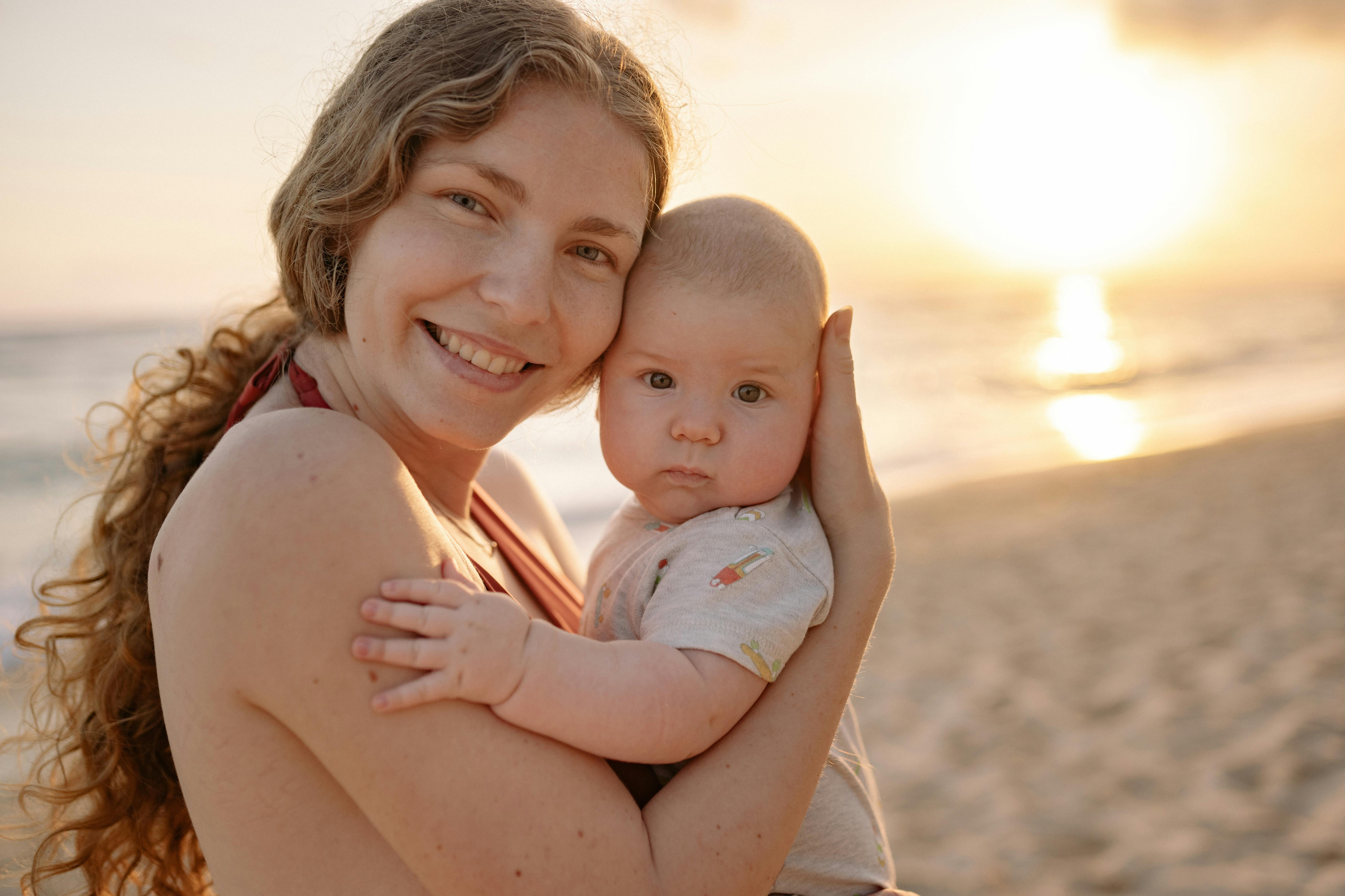 woman carrying her cute baby