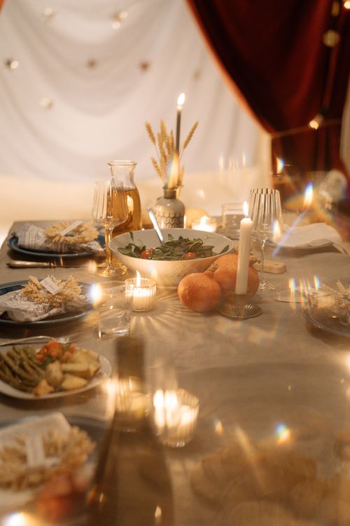 Free A beautifully set dinner table with candles and elegant decor perfect for a festive occasion. Stock Photo