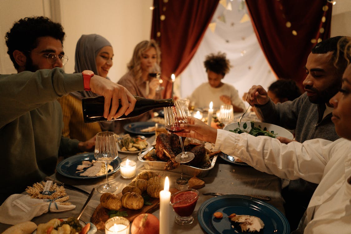 Free A Group of People Having Dinner Together Stock Photo