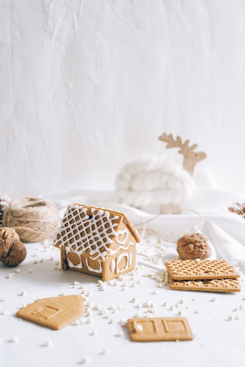 Free A Brown and White Gingerbread House Cookie Stock Photo