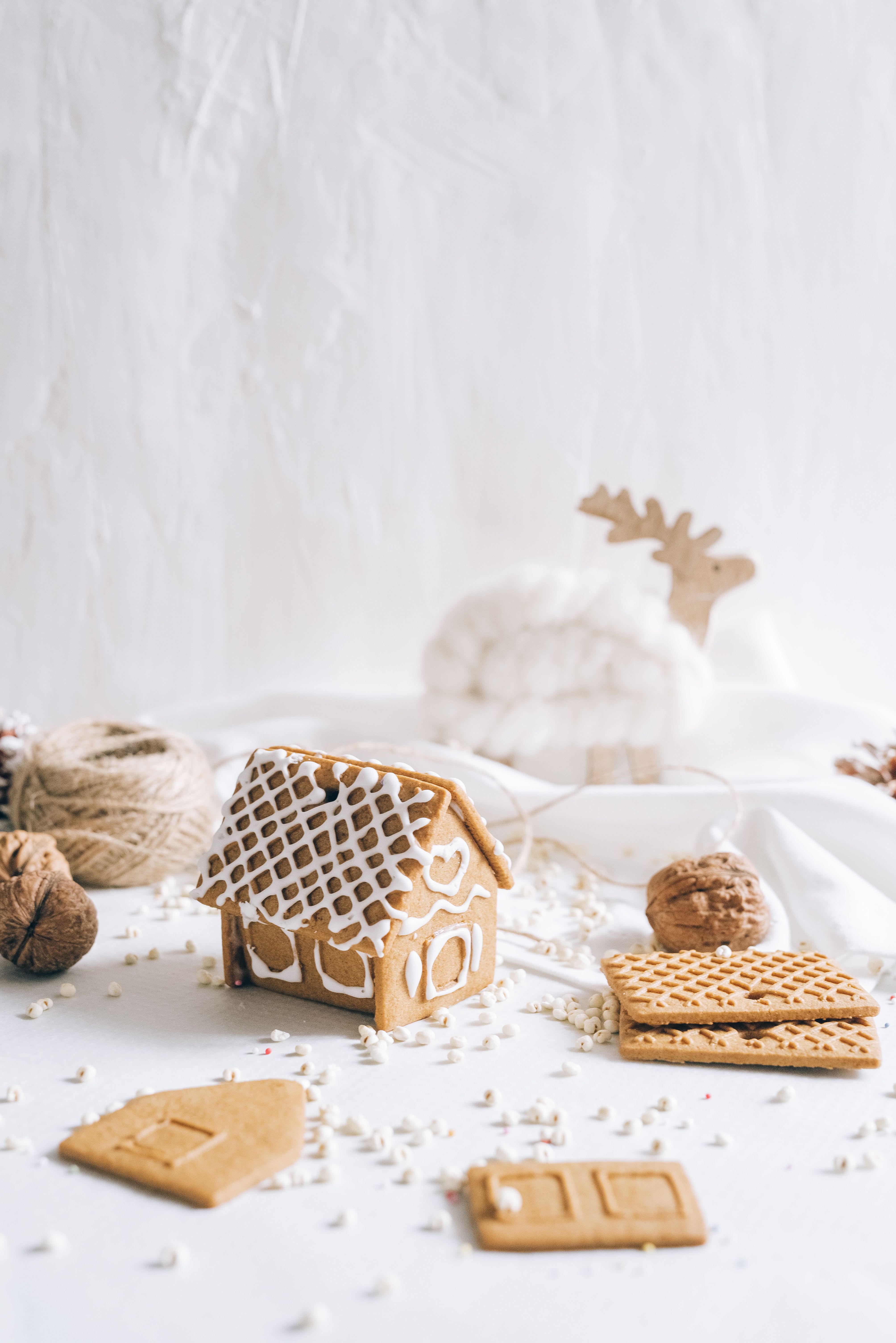 A Brown and White Gingerbread House Cookie · Free Stock Photo