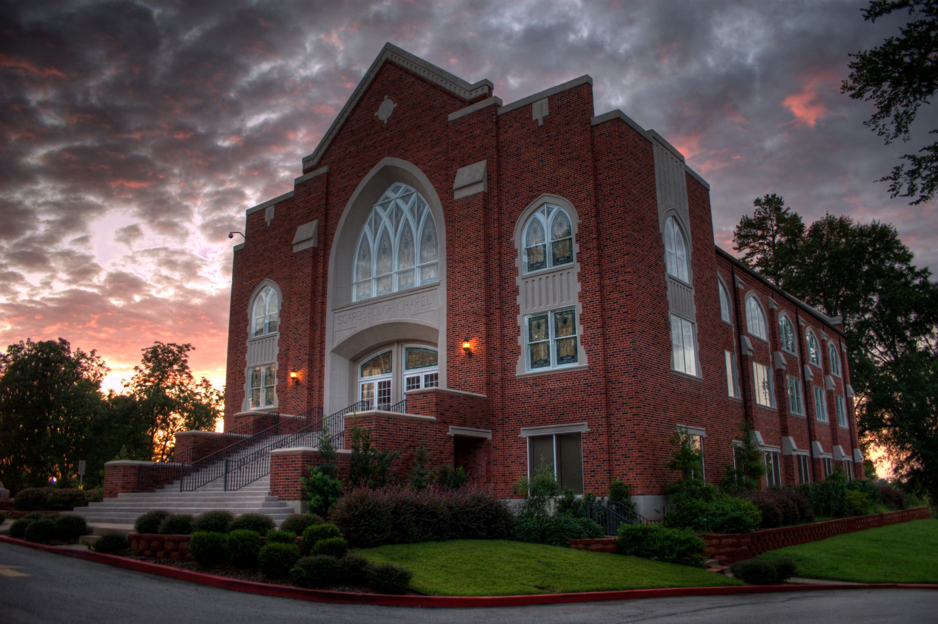 Beautiful sunset view of Scarborough Hall in Marshall, Texas, showcasing its architectural elegance.