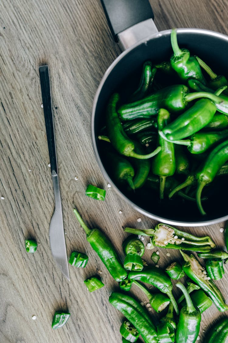 Green Chili Peppers On Pot