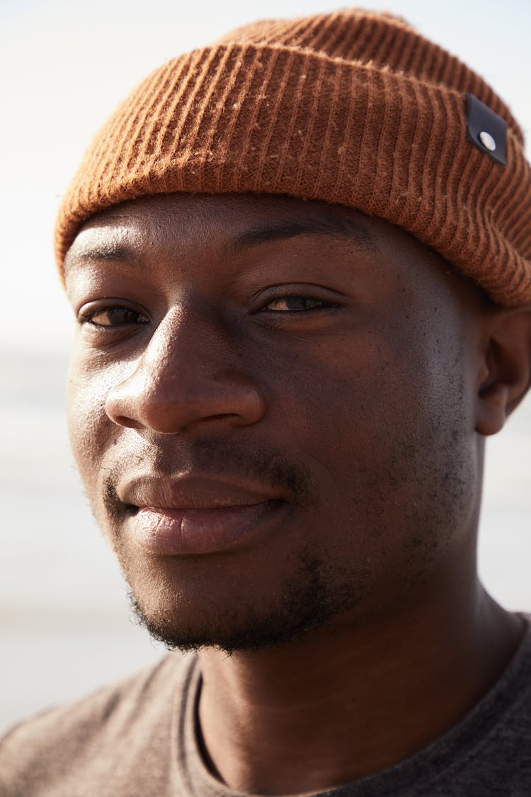 Black Man In Hat Looking At Camera