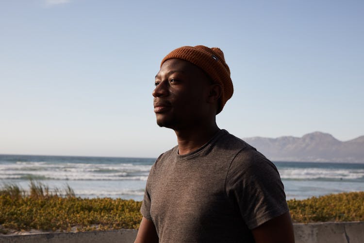 Calm Black Man Near Rippling Water