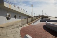 Pier with concrete tile and streetlights
