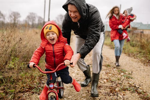 Father Teaching His Son How to Ride a Bike