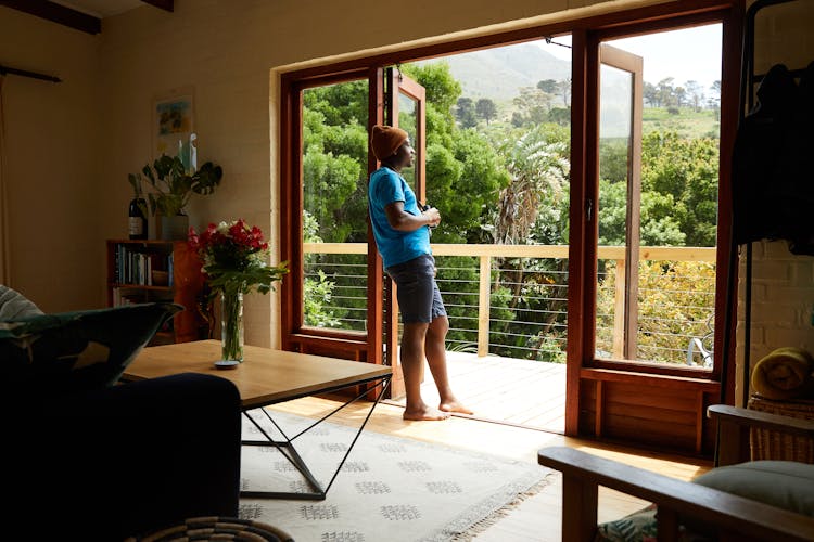 Black Man Near Balcony At Home