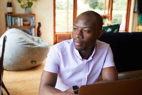 Thoughtful African American man working at home