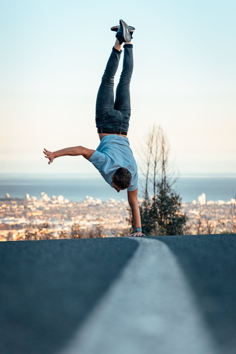 A Man Doing A Handstand