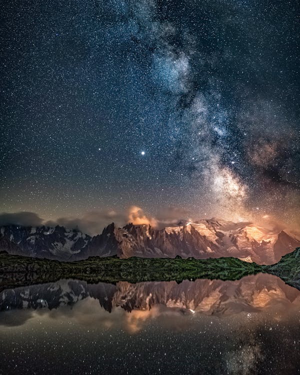 Scenic View of Alps under a Starry Night Sky