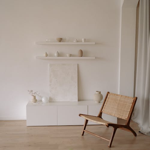 Free Brown Wooden Chair Beside White Wall Stock Photo