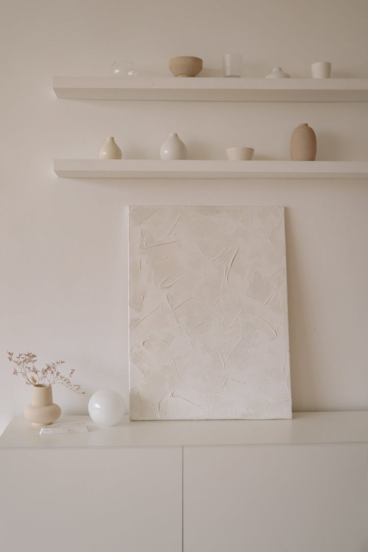 White Wooden Canvas On White Wooden Cabinet