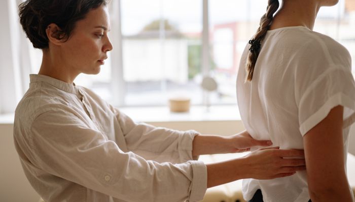 Healthcare professional reviewing documentation on tablet
