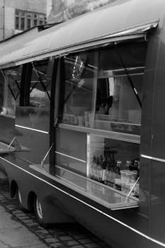 Monochrome image of a classic food truck setup, showcasing elegant design in grayscale.