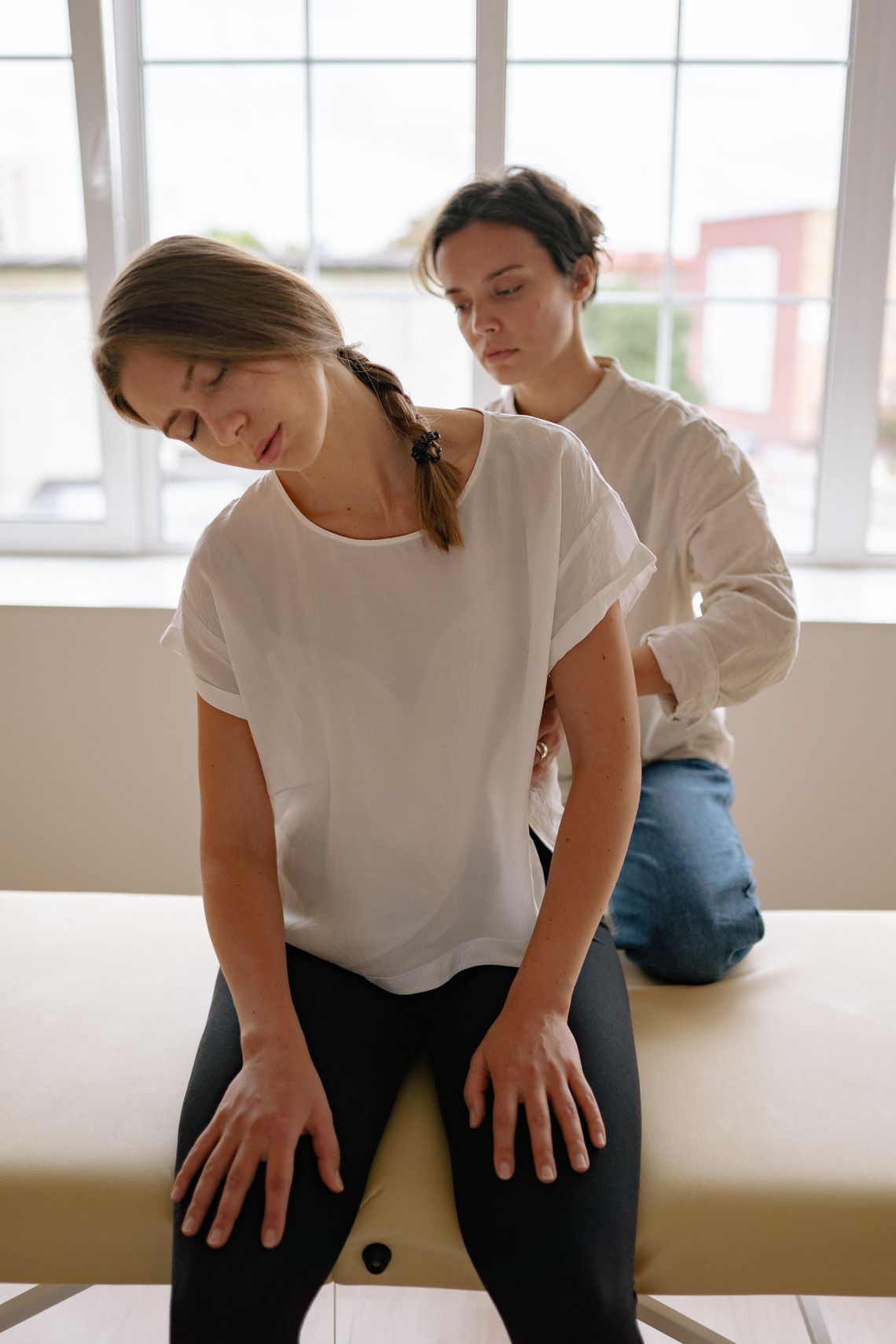 Woman receiving a guided therapeutic massage session