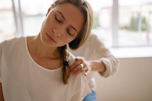 Free A Woman with Her Eyes Closed Having a Massage Stock Photo