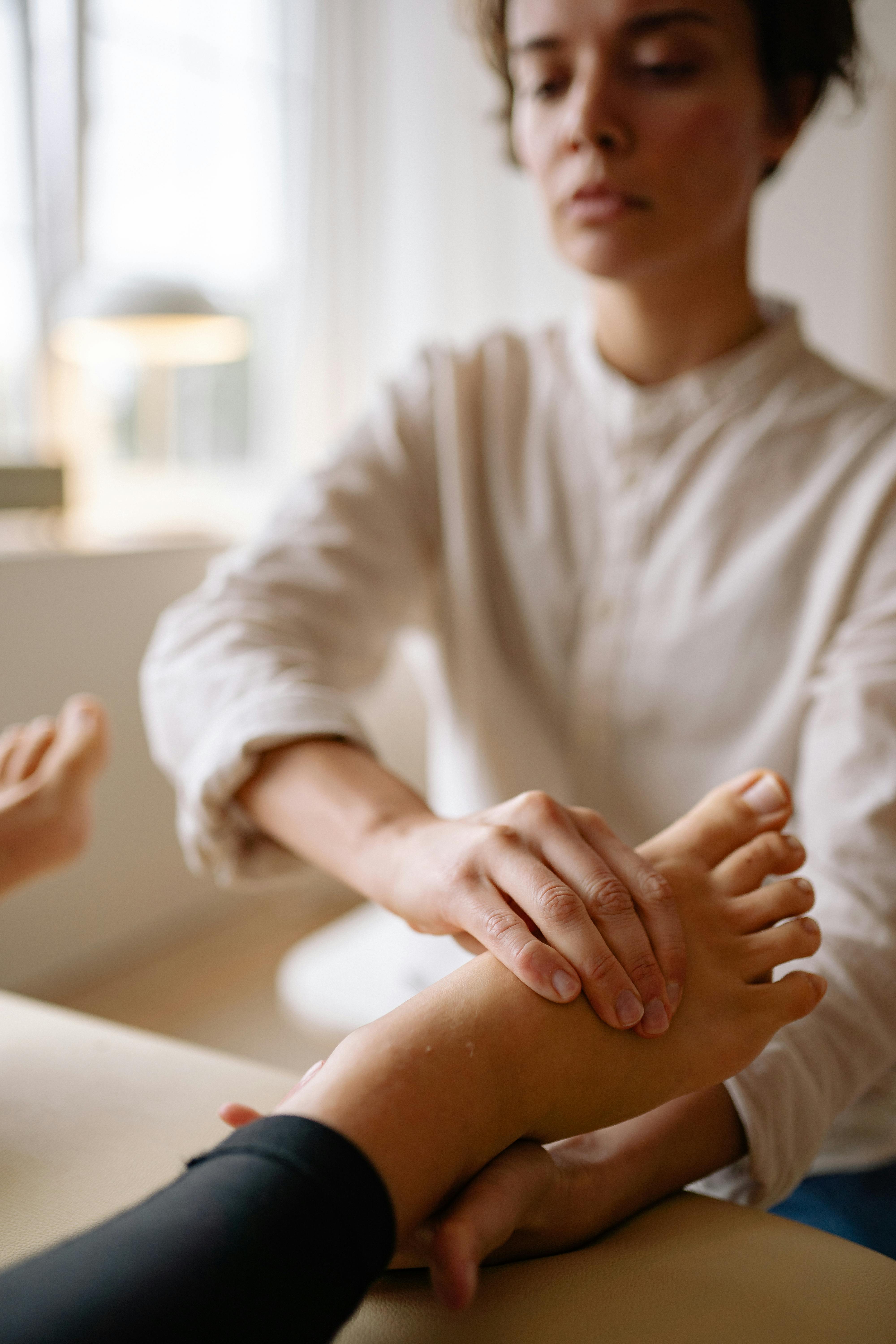 a therapist massaging a foot