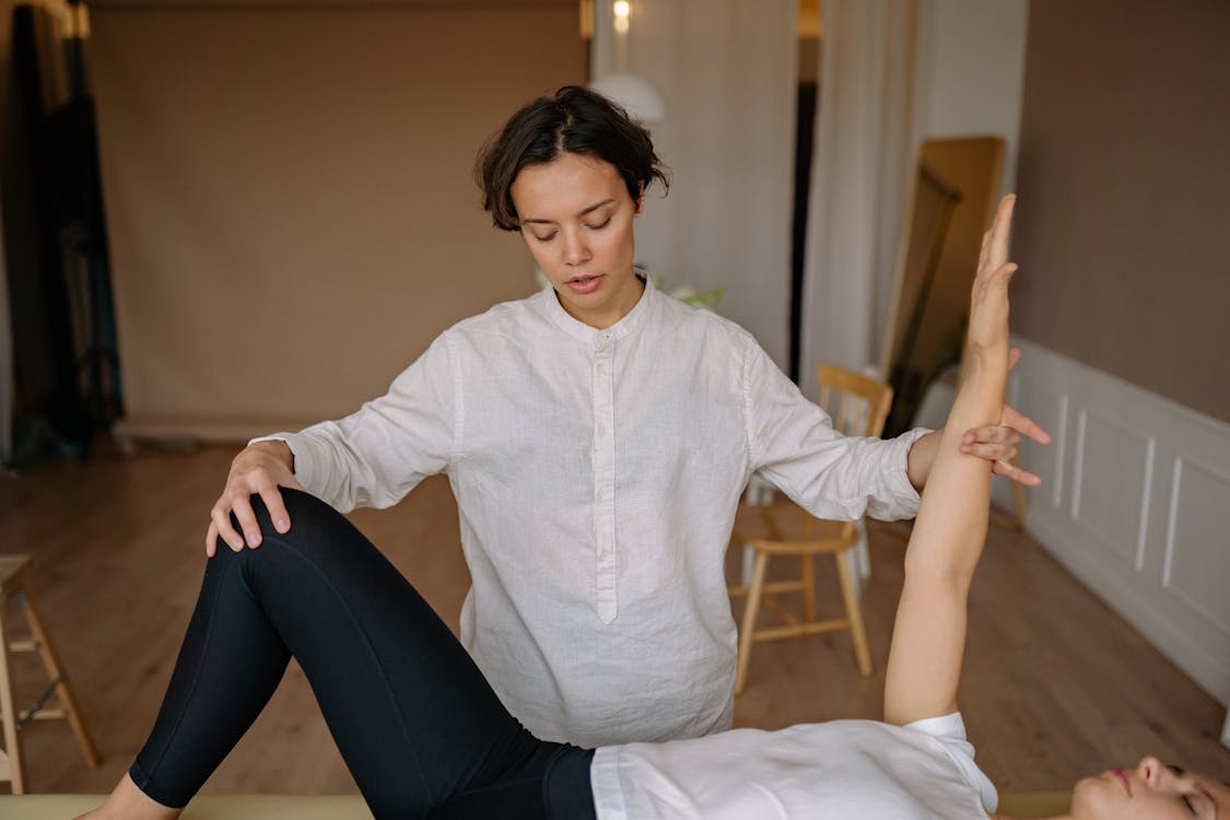 Free A Therapist Massaging a Patient Stock Photo