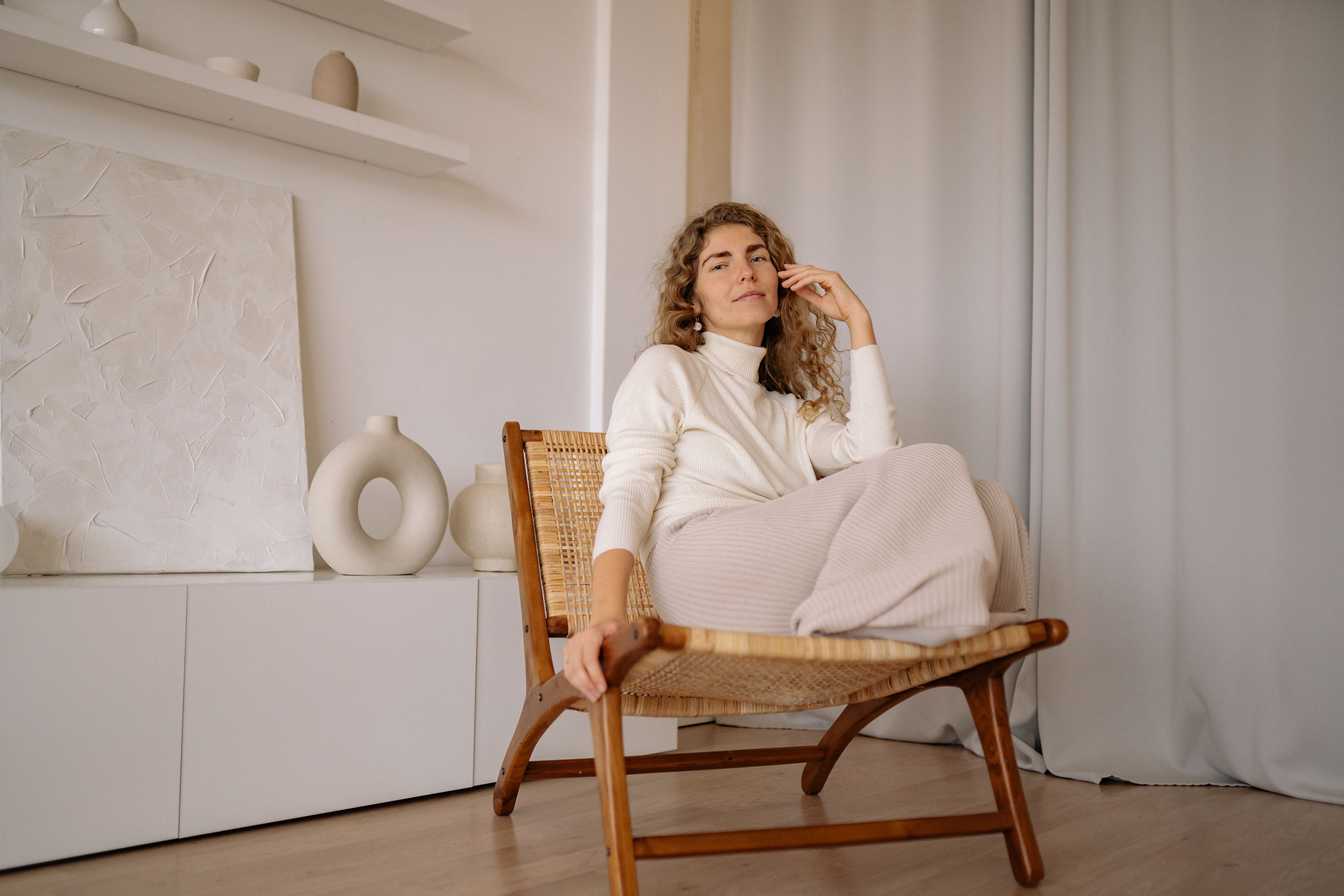 Woman in White Long Sleeve Shirt Sitting on Brown Wooden Chair · Free ...