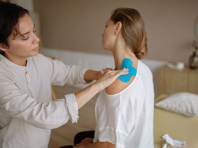 Clinician guiding a shoulder mobility exercise