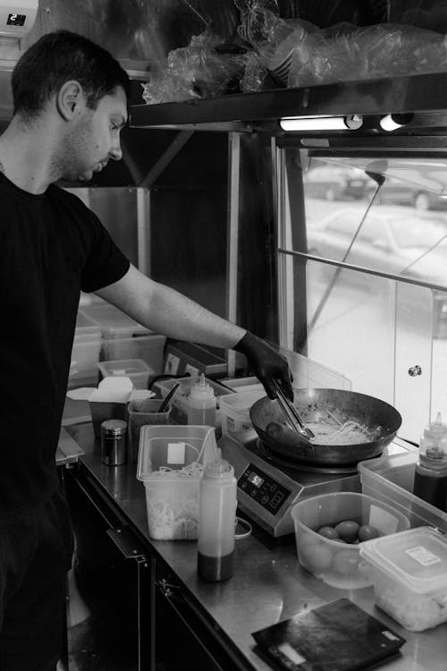 Man in Black T-shirt Cooking