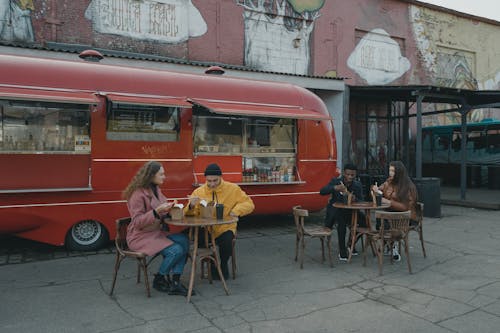 People Dining Near a Food Truck