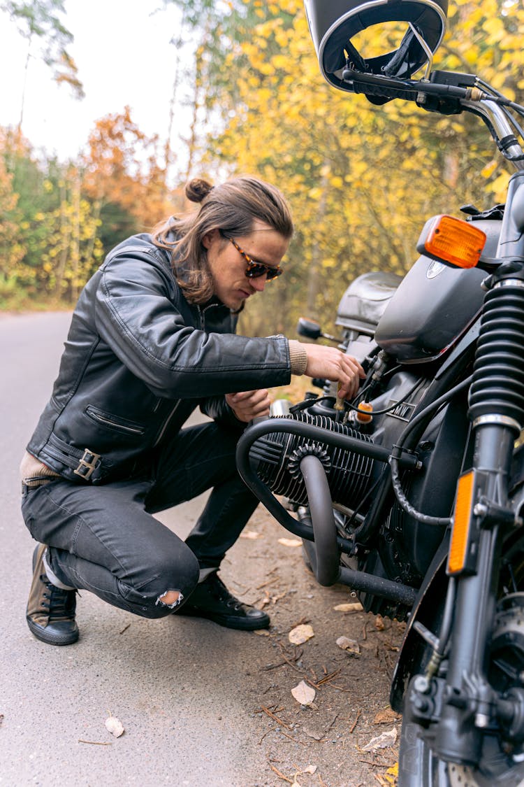 A Biker Checking His Motorbike