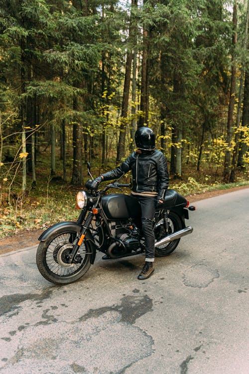 A Person Riding a Black Motorcycle