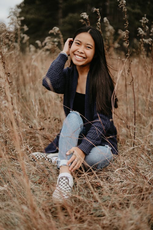 A Sitting Woman Posing with a Smile